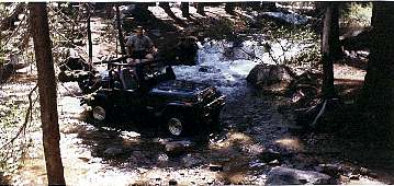 Eric's YJ posing in mid-stream
